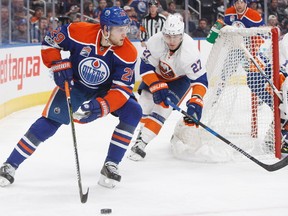 New York Islanders' Anders Lee (27) chases Edmonton Oilers forward Leon Draisaitl (29) during second period NHL action in Edmonton on Tuesday, March 7, 2017.