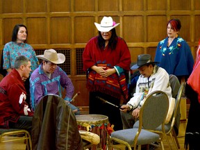 The Whispering Wind Drum Group gives a performance at the Queen's University Senate meeting on Tuesday. (Wade Morris/For The Whig-Standard)