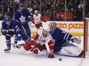 Detroit Red Wings forward Justin Abdelkader battles for the puck against Toronto Maple Leafs goalie Frederik Andersen during an NHL game on March 7, 2017. (Michael Peake/Toronto Sun/Postmedia Network)