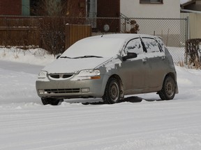 A car that may have been used in a road rage incident on Tuesday morning sits near the corner of 71 Street and 91 Avenue on Wednesday March 8, 2017 in Edmonton.  Greg  Southam / Postmedia