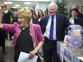 Sharon Johnston, wife of Gov. Gen. David Johnston, celebrates her correct answer to an impromptu quiz as they tour a student wellness centre at Western University in London. (MIKE HENSEN, The London Free Press)