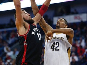 Toronto Raptors centre Jonas Valanciunas goes to the basket against New Orleans Pelicans centre Alexis Ajinca during an NBA game on March 8, 2017. (AP Photo/Gerald Herbert)