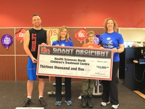 Pat Fletcher, left, general manager of GoodLife Fitness on Lasalle , Nicole Graham, physiotherapist at the Children’s Treatment Centre, James Butcher, a 2016 iCan Bike participant, and Penny Jacob, a physiotherapist at Children’s Treatment Centre, take part in a donation to the CTC. Supplied photo