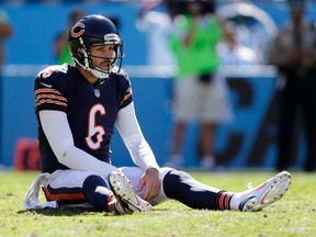 In this Oct. 5, 2014, file photo, Chicago Bears' Jay Cutler (6) sits on the ground after being hit after a pass against the Carolina Panthers during the second half of an NFL football game in Charlotte, N.C. Cutler, who was pegged as the Bears' savior and instead paid the price for their failure to upgrade the talent around him. (AP Photo/Bob Leverone, File)