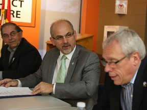 Jason Miller/The Intelligencer
Mayor Taso Christopher (centre) speaks to Coun. Jack Miller, while Coun. Garnet Thompson looks on during Thursday's Mayor's Implementation Meeting.