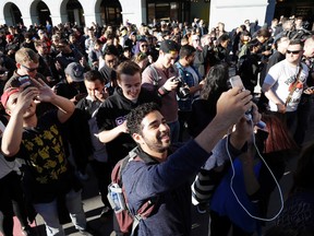 In this Wednesday, July 20, 2016, file photo "Pokemon Go" players begin a group walk along the Embarcadero in San Francisco. Die-hard players and one industry observer say the mass hysteria of the augmented reality smartphone game ‘Pokemon Go’ is likely over. It’s a sigh of relief for some businesses who last summer complained of disrespectful crowds and trespassers and a wistful notion for players who bonded with strangers over the game on city streets and public squares. (AP Photo/Marcio Jose Sanchez, File)