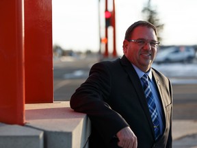 Mayor Gerald Aalbers poses for a photo at the provincial border markers in Lloydminster, Alberta on Thursday, December 22, 2016. Ian Kucerak / Postmedia