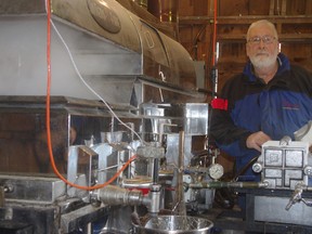 Bruce Jakeman is boiling off maple syrup in his sugarhouse on Trillium Line in Sweaburg. (HEATHER RIVERS, Sentinel-Review)