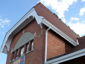 Shingles blow in the wind atop the Sarnia train station Wednesday. Repair and restoration work was recently completed at the Green Street station. (Tyler Kula/Sarnia Observer)