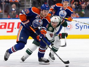 The Edmonton Oilers' Leon Draisaitl (29) battles the Minnesota Wild's Jordan Schroeder (10) during first period NHL action at Rogers Place,  in Edmonton, Tuesday Jan. 31, 2017.