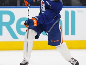 Edmonton's Benoit Pouliot (67) slaps the puck during an Edmonton Oilers practice at Rogers Place in Edmonton ahead of a March 10 game versus the Pittsburgh Penguins on Thursday, March 9, 2017.