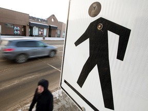 Traffic moves through the 101 Street and 105A Avenue intersection, in Edmonton Thursday, March 9, 2017. City administration has put forward a list of 70 top-priority crosswalks out of 380 that need updating, including the intersection at 101 Street and 105A Avenue. A report is slated to go before the community and public services committee on March 13.