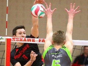 Falcons right side Sam Otten pounds a spike at Matthew Lofgren of the Red Deer Kings during their opening round match at the Canadian college men?s volleyball championship at Fanshawe on Thursday night. The Kings won in straight sets. (MIKE HENSEN, The London Free Press)