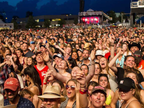 Fans enjoy Brad Paisley performing on the City Stage at Ottawa Bluesfest on Wednesday July 13, 2016. ERROL MCGIHON /POSTMEDIA