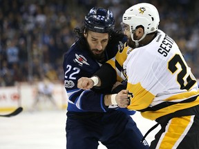 Pittsburgh Penguins forward Tom Sestito fights with Winnipeg Jets forward Chris Thorburn on March 8, 2017. (Kevin King/Winnipeg Sun/Postmedia Network)