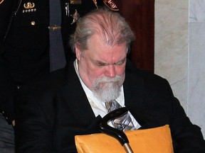 Richard J. Beasley is wheeled into court for his murder trial Wednesday, Feb, 20, 2013 in Akron, Ohio. (AP Photo/Akron Beacon Journal, Karen Schiely, Pool)