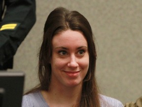 Casey Anthony smiles before the start of her sentencing hearing on charges of lying to a law enforcement officer at the Orange County Courthouse July 7, 2011 in Orlando, Florida. (Photo by Joe Burbank-Pool/Getty Images)