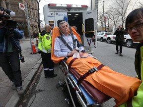 Ontario Court Justice of the Peace Vladimir Bubrin, 68, is wheeled out of the Old City Hall courts after he complained of being dizzy and nauseous and burning up before entering the court to preside over the case of the "Prince of Pot" Marc Emery and his wife Jodie who are charged with drug trafficking, conspiracy and possession and were arrested at Pearson International Airport on Wednesday night on Friday March 10, 2017. (Jack Boland/Toronto Sun)