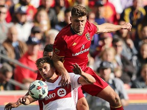 Real Salt Lake defender David Horst climbs on TFC’s Nick Hagglund during last week’s game. (AP)