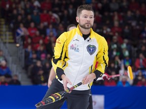 Manitoba skip Mike McEwen watches a rock against Newfoundland and Labrador in 1 vs. 2 Page playoff game action at the Tim Hortons Brier curling championship at Mile One Centre, in St. John's on Friday, March 10, 2017. THE CANADIAN PRESS/Andrew Vaughan