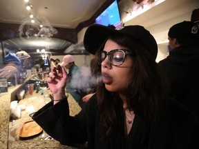 It was business as usual for Emily Walsh, an employee at Cannabis Culture  on Church St. (STAN BEHAL, Toronto Sun)