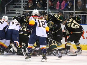 The entire Knights squad convene in the Knights crease with Tyler Parsons to keep the puck out, keeping Jordan Sambrook, Taylor Raddysh and Alex DeBrincat at bay during their game at Budweiser Gardens on Friday March 10, 2017. (MIKE HENSEN, The London Free Press)