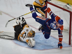 Edmonton Oilers captain Connor McDavid flies through the air after rushing Pittsburgh Penguins goalie Marc-Andre Fleury at Rogers Place in Edmonton on Saturday, March 10, 2017. (Ed Kaiser)