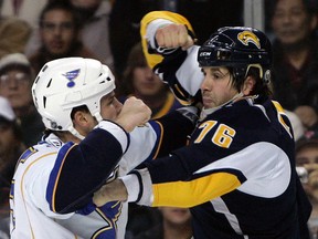 Buffalo Sabres’ Andrew Peters (76) fights with St. Louis Blues’ Cam Janssen during an NHL game in Buffalo, N.Y., Wednesday, Nov. 12, 2008. (THE CANADIAN PRESS/AP/David Duprey)