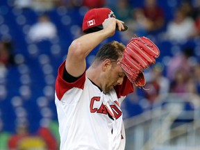 Canadian pitcher Scott Mathieson wipes his face during a World Baseball Classic first-round game against Colombia Saturday, March 11, 2017, in Miami. (AP Photo/Lynne Sladky)