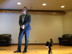 University of Toronto professor Jordan Peterson addresses the crowd at the public library Saturday.