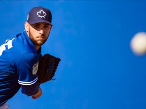 Toronto Blue Jays starting pitcher Marco Estrada throws a bullpen session during spring training in Dunedin, Fla., on Friday, February 17, 2017. (THE CANADIAN PRESS/Nathan Denette)
