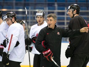 Team Canada head coach Dave Tippett calls on a drill during practice Thursday, May 8, 2014 at the IIHF World Hockey Championship in Minsk, Belarus. (THE CANADIAN PRESS/Jacques Boissinot)
