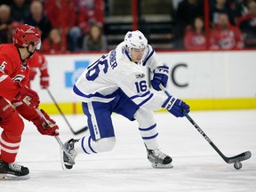 Toronto Maple Leafs’ Mitch Marner (16) skates away from Carolina Hurricanes’ Noah Hanifin (5) in Raleigh, N.C., Saturday, March 11, 2017. (AP Photo/Gerry Broome)