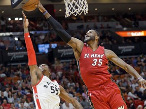 Miami Heat forward Willie Reed (35) blocks a shot by Toronto Raptors guard Delon Wright Saturday, March 11, 2017, in Miami. (AP Photo/Alan Diaz)