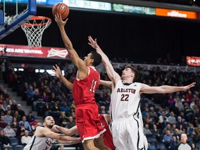 McGill's Michael Peterkin drives to the hoop against Carleton's Mitch Wood for two of his 11 points on Saturday.