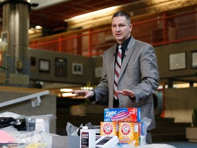 Edmonton Police Service Staff Sgt. Kevin Berge with Edmonton Drug and Gang Enforcemant (EDGE) outlines the material seized in a drug bust involving a secret compartment at police headquarters in Edmonton on Wednesday, January 25, 2017. Ian Kucerak / Postmedia