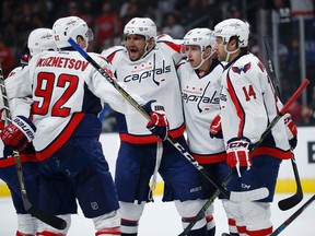 From left to right, Washington Capitals center Evgeny Kuznetsov, of Russia, left wing Alex Ovechkin, of Russia, left wing Jakub Vrana and right wing Justin Williams celebrate after a goal by Vrana during the first period of an NHL hockey game against the Los Angeles Kings,March 11, 2017, in Los Angeles. (RYAN KANG/AP)