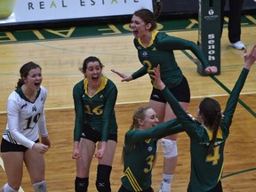 University of Alberta Pandas celebrate after deafeating the UBC Thunderbirds in the gold medal game during the Canada West Women's Final Four volleyball tournament at the Saville Centre in Edmonton, Sunday, March 11, 2017.