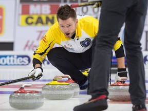Manitoba skip Mike McEwen reacts to a rock as they play Team Canada in draw 20 semifinal action at the Tim Hortons Brier curling championship at Mile One Centre, in St. John's on Saturday, March 11, 2017. THE CANADIAN PRESS/Andrew Vaughan