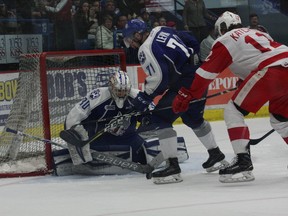 Sudbury Wolves goaltender Jake McGrath looks to gather the puck while teammate David Levin and the Soo Greyhounds' Boris Katchouk also look for the puck during OHL action at Sudbury Community Arena on Sunday afternoon. Bruce Heidman/The Sudbury Star