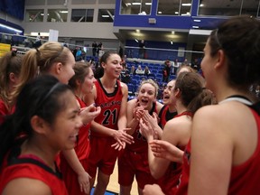 Carleton Ravens celebrate winning the bronze medal game against the Queen's Gaels at the USports Women's Basketball Championship in Victoria, B.C., on Sunday, March 12, 2017. (THE CANADIAN PRESS/Chad Hipolito)