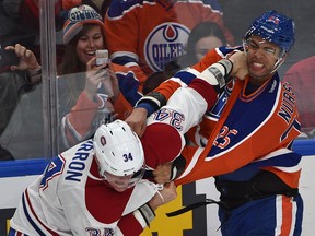 Edmonton Oilers Darnell Nurse (25) and Montreal Canadiens Michael McCarron (34) fighting during first period NHL action at Rogers Place in Edmonton, Sunday, March 12, 2017. Ed Kaiser/Postmedia