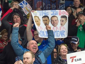Fans cheer as Newfoundland and Labrador plays Team Canada in the gold medal game of the Tim Hortons Brier at Mile One Centre in St. John's on Sunday, March 12, 2017. (/Andrew Vaughan/The Canadian Press)