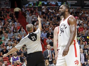 Official Scott Wall (left) ejects Raptors forward Patrick Patterson (right) during second half NBA action against the Heat in Miami on Saturday, March 11, 2017. (Alan Diaz/AP Photo)