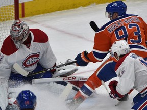 Edmonton Oilers forward Ryan Nugent-Hopkins tries to get the puck over Montreal Canadiens goalie Carey Price at Rogers Place in Edmonton on Monday, March 12, 2017. (Ed Kaiser)