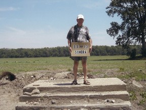 File photo: Former S.S. #13 Sombra (West Becher) student Jim Hay stands on the steps of what is left of the school. A school reunion is scheduled for April 25 of this year.