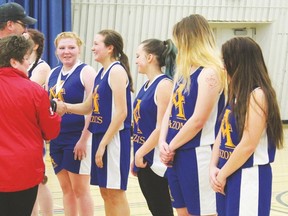 Frank Maddock girls Amazons team are being presented with Bronze medals after hosting their first ever Amazons Classic basketball tournament held over the March 3 weekend.