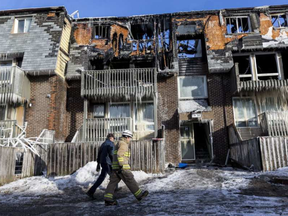 Ottawa Fire Services Investigators on the scene at 34 Northview Road where a fire affected 52 units and displaced as many as 70 people. March 13,2017. ERROL MCGIHON / POSTMEDIA