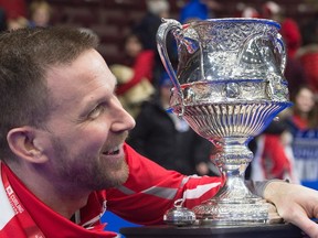Newfoundland and Labrador skip Brad Gushue holds the Brier Tankard after defeating Team Canada 7-6 to win the Tim Hortons Brier curling championship at Mile One Centre in St. John's on Sunday, March 12, 2017. (Andrew Vaughan/The Canadian Press)