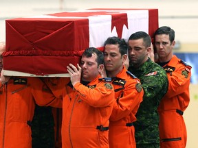 Pallbearers carry to remains of Master Cpl. Alfred Barr during ramp ceremony at 17 Wing Winnipeg on Mon., March 13, 2017. The Royal Canadian Air Force Search and Rescue technician was killed in a training accident near Yorkton, Sask., on March 8. Kevin King/Winnipeg Sun/Postmedia Network